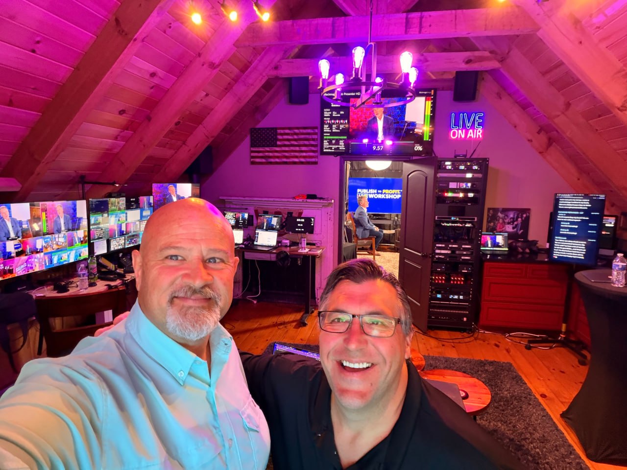 Matt and a collaborator inside a fully equipped production control room